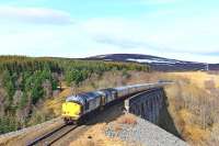 Over Slochd Viaduct in bright sunshine on 6 April 2015, DRS 37607 and 37218 head south with the Pathfinder 1Z73 Inverness-Eastleigh railtour.<br><br>[John Gray 06/04/2015]