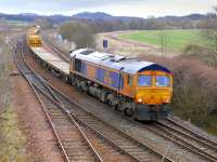 GBRf 66730 leads a Longannet - Millerhill ballast train past Inverkeithing East Junction on  29 March.<br><br>[Bill Roberton 29/03/2015]