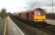 DBS 60091 rumbles through Tamworth High Level towards Birmingham with a train of bogie tanks on 20 December. 'Tugs' at work are now a rare sight, but a 66 might not be able to haul this tonnage.<br><br>[Ken Strachan 20/12/2014]