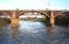 The 1848 Caledonian Railway cast iron viaduct at Uddingston (foreground) looks solid enough in 2015 (and was put on the market for sale in 1993) but is now designated <I>'At Risk'</I>. Its 1903 latticework replacement (behind) still carries the West Coast Main Line, Edinburgh and local traffic across the Clyde between Uddingston and Newton.<br><br>[Colin McDonald 13/01/2015]