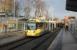 A Manchester bound tram (3070) calls at West Didsbury on 17th January. The original Withington & West Didsbury railway station, closed in 1961, lay just beyond the overbridge but the new tram station is much better located for the village centre.  <br><br>[Mark Bartlett 17/01/2015]