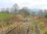 Looking south from the site of Festiniog station at Llan Ffestiniog towards Trawsfynydd in March 2015. The line closed in 1961 but reopened for traffic to the nuclear power station in 1964. The last flask train ran in 1998 when Trawsfynydd closed but the disused tracks remain. [Ref queries 2931 / 4434]  <br><br>[Mark Bartlett 15/03/2015]