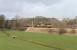 Running alongside the Ou Beck on 31 March, past the loops of the same name, is Colas Rail 66849 with a loaded log train from Carlisle to Chirk.<br><br>[Mark Bartlett 31/03/2015]