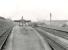 A train for Rutherglen stands at the spacious Dalmuir Riverside station on 11 April 1958 behind Stanier 2-6-2 tank 40152. [Railscot note: The large works off to the left was once part of the original Beardmore Naval Construction Yard, later (1994) to become the site of the private Healthcare International Hospital (now the Jubilee Hospital) and Beardmore Hotel & Conference Centre.]<br><br>[G H Robin collection by courtesy of the Mitchell Library, Glasgow 11/04/1958]