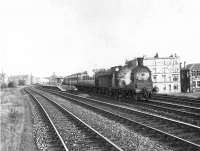 Ex-Caledonian 0-6-0 57564 leaves Kilbowie on 27 September 1957 with a Rutherglen - Balloch train. <br><br>[G H Robin collection by courtesy of the Mitchell Library, Glasgow 27/09/1957]