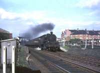 The 5.33pm St Enoch - East Kilbride hurries south through Crossmyloof station on 25 May 1965 behind BR Standard tank 80058.<br><br>[John Robin 25/05/1965]