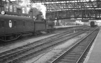 An afternoon arrival drifts into platform 4 at an otherwise quiet looking Carlisle station on Saturday 3 September 1960. The train is the 12.25pm stopping service from Hawick and the locomotive ex-NB class D34 4-4-0 62488 <I>Glen Aladale</I>. <br><br>[K A Gray 03/09/1960]