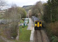 The 1511 Blaenau Ffestiniog - Llandudno service passes the former island platform of the well kept but now quiet Dolwyddelan station on 14th April 2015. The station also had a goods loop and shed serving a slate quarry on the hill to the right.<br><br>[Colin McDonald 14/04/2015]