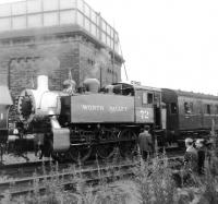 Formerly of USA Transportation, Southern Railway, and British Railways. USA Class 0-6-0T 30072, seen in one of its many guises as Worth Valley no 72, is one of the locomotives on the re-opening special awaiting departure from Keighley Station on 29 June 1968. [See image 24540]<br><br>[David Pesterfield 29/06/1968]