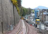 Driver's-eye equivalent view of the approach to Galashiels station. Scene on 4 May 2015 with a roadrail machine standing alongside the platform, work in progress on the Transport Interchange opposite, 2-way traffic reinstated on the A7 Ladhope Vale - all being closely observed by one of the Eildon Hills to the south.<br><br>[John Furnevel 04/05/2015]