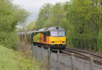 A shiny Colas Rail Class 60 waits for departure time with the bitumen empties at Strand Road sidings on 5th May 2015. The train normally runs MWF only but due to the May Bank Holiday 60021 had brought the loaded tanks from Lincolnshire on the Tuesday.<br><br>[Mark Bartlett 05/05/2015]