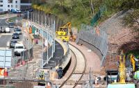 Work continuing at the new Galashiels station on 4 May 2015. The exit ramp down to road level and the pedestrian crossing is just to the left of the roadrail machine.<br><br>[John Furnevel 04/05/2015]