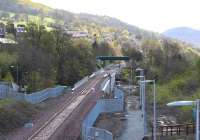 View south from Kilnknowe Street bridge showing the rail approach to Galashiels on 4 May 2015. A much tidier scene generally, with the Plumtreehall Brae footbridge now in place over the line in the background. [See image 47225]<br><br>[John Furnevel 04/05/2015]