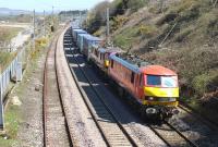 A Mossend to Daventry container service is double headed through Hest Bank by DBS 90036 and 90026 on 21st April 2015.<br><br>[Mark Bartlett 21/04/2015]