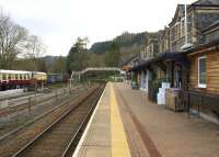 View south on the remaining single platform at Betws-y-Coed on 14th April 2015. The static coaches and vans on the right are part of the Conwy Valley Railway Museum and are located on a section of the line to the former goods shed.<br><br>[Colin McDonald 14/04/2015]