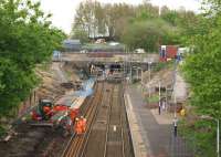 A view of Farnworth station towards the tunnels (and Salford Crescent) on 10 May 2015 as the platform on the left is being removed in order to realign the approach to the tunnel. Although the line was closed over the weekend it is open Monday to Friday with all services using the down line (on the right) while work continues on the left hand bore. The station is however closed throughout the work which is scheduled to last until October.<br><br>[John McIntyre 10/05/2015]