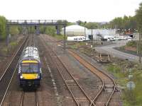 The 1100 Edinburgh - Glasgow Queen Street, formed by DMU 170431, passes  through the former Cadder yard on 13 May 2015. The new EGIP depot stands on the right. [See image 16962]<br><br>[Colin McDonald 13/05/2015]