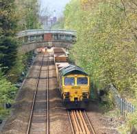 Freightliner 66509 stands on the up line between Moses Gate and Farnworth on 10 May 2015. It was one of several engineering trains operating in connection with track relaying work around Moses Gate station.<br><br>[John McIntyre 10/05/2015]