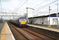 A fine morning at Bathgate on 15 May 2015, with the 0857 Milngavie - Edinburgh about to come to a halt at platform 1.<br><br>[John Furnevel 15/05/2015]