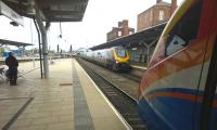 A down CrossCountry Voyager meets an up East Midlands Meridian at Derby on 4 May, while a Nottingham service approaches Etches Park in the background. <br><br>[Ken Strachan 04/05/2015]