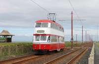 The <I>Gold</I> Blackpool Heritage timetable on 24th May meant six classic trams were in service, including <I>Balloon</I> No. 701. The red and white double decker is seen here on the cliffs approaching Little Bispham station with one of five services that worked through to Fleetwood.   <br><br>[Mark Bartlett 24/05/2015]