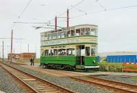 Blackpool <I>Standard</I> No. 147 accesses the turning circle at Little Bispham with a heritage tour while the conductor resets the points for the through line. Looking at this traditionally designed tramcar from the 1920s it is easy to understand the impact of the streamlined <I>Balloons</I> that were brought into service less than ten years later [See image 25693]. <br><br>[Mark Bartlett 24/05/2015]