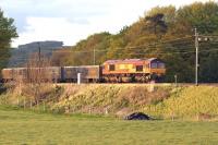 The evening sun catches DBS 66019 heading south along the WCML near to Garstang & Catterall on 13 May 2015. The train is the 6V71 Hardendale Quarry to Margam limestone working.<br><br>[John McIntyre 13/05/2015]
