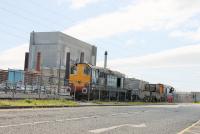DRS EE Type 1s 20305 and 20309, just arrived at Heysham Power Station on 26th May, with two empty flasks from Sellafield. The flask wagons will be exchanged for a return load and moved into the nuclear complex by the internal shunter. <br><br>[Mark Bartlett 26/05/2015]