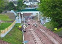 The points at the northern end of the double track Gorebridge - Tynehead section of the Borders Railway. Long lens view north from Fushiebridge on 29 May 2015, with Gorebridge station just beyond Lady Brae road bridge in the left background. Note also the new pedestrian footbridge (not yet open). <br><br>[John Furnevel 29/05/2015]