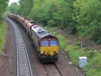 66075 coasts downhill towards Dalgety Bay on 31 May with a Dalmeny Junction - Millerhill (via the Fife Circle) empty ballast train, in connection with the EGIP project.<br><br>[Bill Roberton 31/05/2015]