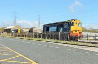 DRS 20309 leads two flask wagons and classmate 20305 along the spur to the power station that leads off the main Heysham Port branch. The train is running alongside the road to the IOMSP ferry terminal on 26th May 2015. <br><br>[Mark Bartlett 26/05/2015]