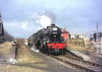 The SLS <I>Scottish Rambler No 3</I> railtour at Larkhall East on 29 March 1964. Locomotive in charge is <I>Crab</I> 2-6-0 42737. The special was on its way south to Swinhill.<br><br>[John Robin 29/03/1964]