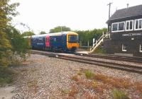 An up First Great Western 'Thames Turbo' DMU accelerates past the signal box at Moreton-in-Marsh on 23rd May 2015 on its way to Paddington. [See image 35794]<br><br>[Ken Strachan 23/05/2015]