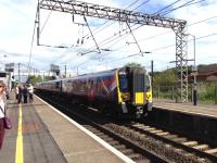 The 0907 Glasgow Central - Manchester Airport arrives at Lockerbie on 4 June 2015.<br><br>[Bruce McCartney 04/06/2015]