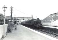 Fairburn 2-6-4T 42202 arrives at Kilwinning on 4 July 1959 with a Glasgow St Enoch - Ayr train.<br><br>[G H Robin collection by courtesy of the Mitchell Library, Glasgow 04/07/1959]