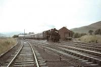 Black 5 44828 with a down express passing Elvanfoot on 30 July 1966. The spur to the Wanlockhead branch is on the right.   <br><br>[John Robin 30/07/1966]