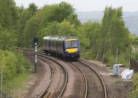 OHLE mast bases are just visible alongside the trackbed to the right of the train as a late afternoon service from Glasgow Queen Street to Edinburgh approaches Falkirk High on 4 May. In the other direction, mast bases are now in place  between the Falkirk tunnel and Polmont.<br><br>[Colin McDonald 04/05/2015]