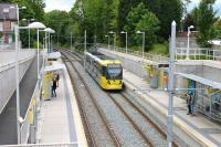 Metrolink 3066 calls at Burton Road in Didsbury with a service from Rochdale to East Didsbury. [See image 40061] from 2012 when this tram station and the East Didsbury line were still under construction. <br><br>[Mark Bartlett 08/06/2015]