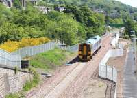 An early afternoon driver training turn runs north out of Galashiels on 10 June 2015. The train has recently crossed the Gala Water and is passing the site of Kilnknowe Junction where the Peebles Loop once diverged from the Waverley Route.<br><br>[John Furnevel 10/06/2015]