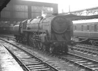 BR light Pacific 72009 <I>Clan Stewart</I> held on the centre road at Carlisle on a wet 17 August 1963. The locomotive is waiting to run north to Kingmoor shed after bringing in the 8am Aberdeen - Manchester (currently standing at platform 4). [See image 43696]<br><br>[K A Gray 17/08/1963]