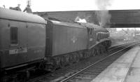 60007 <I>Sir Nigel Gresley</I> taking on water at the north end of Stirling station on 7 June 1965. The train is the 5.30pm Glasgow Buchanan Street - Aberdeen.<br><br>[K A Gray 07/06/1965]