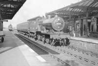 An Ardrossan Winton Pier - Kilmarnock stopping train, recently arrived at Irvine on 24 September 1949. Locomotive in charge is Hurlford shed's 2P 4-4-0 no 40644. Standing on the down line in the background is St Rollox based ex-Caledonian 0-6-0 no 57557.    <br><br>[G H Robin collection by courtesy of the Mitchell Library, Glasgow 24/09/1949]