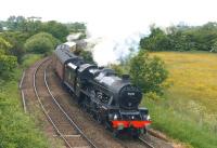 Jubilee no. 45690 <I>Leander</I> climbs the bank from Farington Curve Jct with <I>The Fellsman</I> railtour from Lancaster to Carlisle on 17 June 2015. The locomotive is working hard as it approaches Coote Lane road bridge with 11 coaches and a Class 47 on the rear.<br><br>[John McIntyre 17/06/2015]