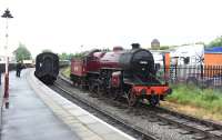 Platform scene at Heywood on the East Lancs Railway on 20 June 2015 with LMS Hughes <I>Crab</I> 13065 in the process of running round its train.<br><br>[Peter Todd 20/06/2015]