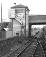 The signal box at Holm Junction, photographed from a passing train on 31 August 1985. Ardrossan South Beach station is on the other side of the bridge carrying South Beach Road.  <br><br>[Bill Roberton 31/08/1985]