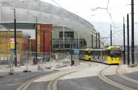 Double tram tracks are in place again from Shudehill through Manchester Victoria, while at the new side entrance two further tracks are being laid for the <I>Second City Crossing</I>. A double tram led by 3036 climbs Balloon St on 25th June heading for Shudehill as a further double set passes through Victoria bound for Bury.  <br><br>[Mark Bartlett 25/06/2015]