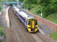 ScotRail 158733 leads two sister units through Dalgety Bay on 21 June with the 2Z60 09.52 Shotts to Burntisland charter conveying participants on the annual St Patrick's picnic outing.<br><br>[Bill Roberton 21/06/2015]