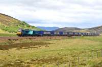 DRS 68001 <I>Evolution</I> races south on the long straight section north of Dalwhinnie on 20 June 2015 with a train of eighteen empty containers bound for Mossend Yard.<br><br>[John Gray 20/06/2015]