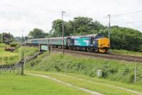 37218 leads the 2C47 Preston to Barrow service north through Bay Horse on 24th June 2015. 37402 was bringing up the rear. The two loco hauled sets mainly shuttle between Barrow and Carlisle but one makes a return trip through to Preston each weekday morning.  <br><br>[Mark Bartlett 24/06/2015]