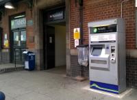Marketing 101 - this ticket machine at Nuneaton Trent Valley used to be locked up at night, behind the black painted doors on the extreme left. Now that it is accessible after 8pm, perhaps they will sell more tickets?<br><br>[Ken Strachan 19/06/2015]